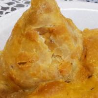 Veggie Samosa · Filled pastry puff with potatoes, peas & other seasoned vegetables served w/ chutney