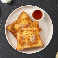 French Toast · Fresh bread battered in egg, milk, and cinnamon cooked until spongy and golden brown.