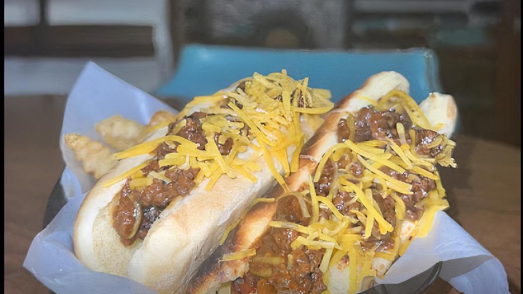 2 Grilled Hot Dogs & Fries · Two grilled hot dogs and fries. With your choice of toppings. Ketchup, mustard, onion, cheese, and hot dog chili.