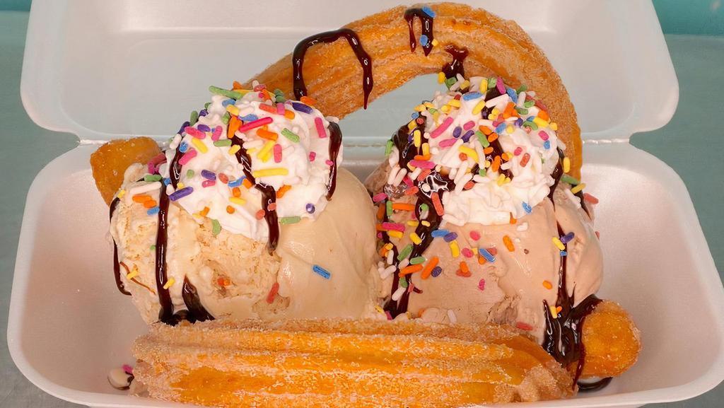 Sundae Churro · Best when shared! Yum.
Two scoops of homemade ice cream, two churros, lechera, cajeta, whipped cream and sprinkles. 

Dos bolitas de nieve, dos churro, lechera, cajeta, whipped cream y sprinkles