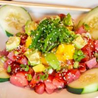 Tuna Poke Bowl · Sushi grade tuna, sliced cucumber, scallions tossed with a Japanese vinaigrette. Served over...