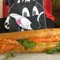 Grilled Pork Banh Mi · Pork cooked in smoky savory salty sauce.