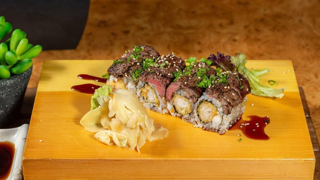 Filet And Lobster Roll · Lobster tempura with seared fillet mignon on top dressed with scallion and chef's special sauce.