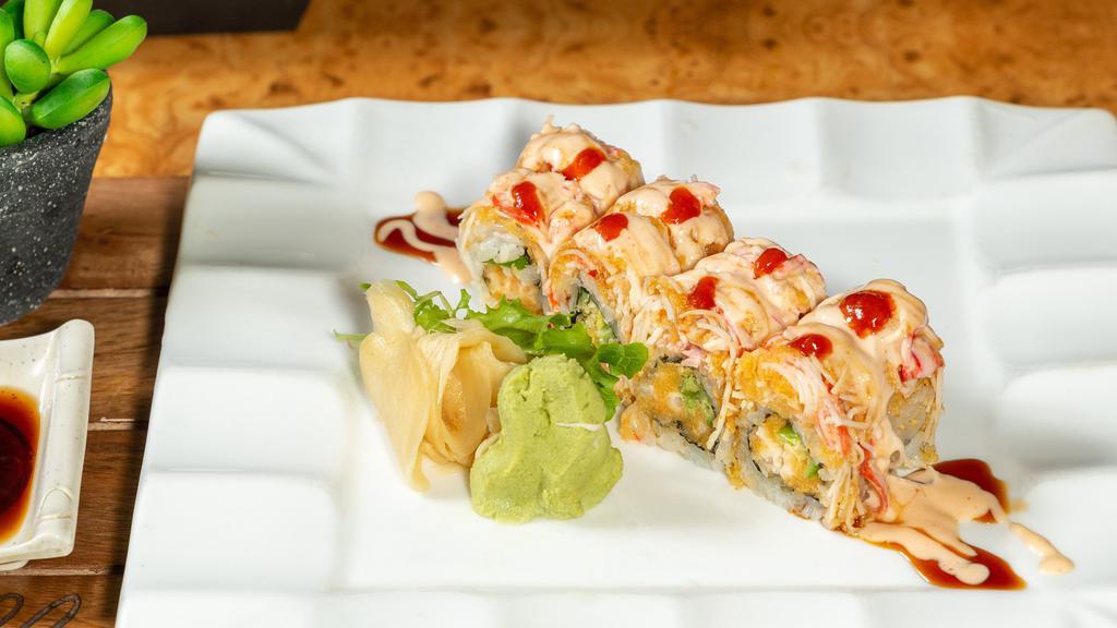 Burning Desire Roll · Spicy crunch shrimp, avocado, jalapeno inside, spicy crab, spicy mayo, crunch, tobiko & chili on top.