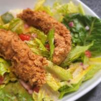 Crispy Chicken Tender Salad  · Classic Crispy Chicken Tender Salad with Mixed Lettuce Leaves, Cucumbers, Red Onions, Tomato...