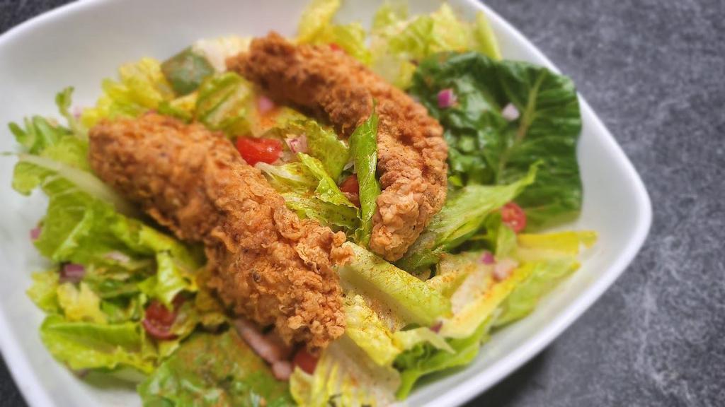 Crispy Chicken Tender Salad  · Classic Crispy Chicken Tender Salad with Mixed Lettuce Leaves, Cucumbers, Red Onions, Tomatoes, and Croutons