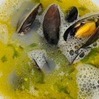 Steamed Mussels · Steamed in a light flavored broth seasoned with shallots, garlic & basil.