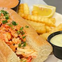 Lobster Roll · Made with lobster tail and claw meat, served with fries Choice of fresh lemon garlic butter ...