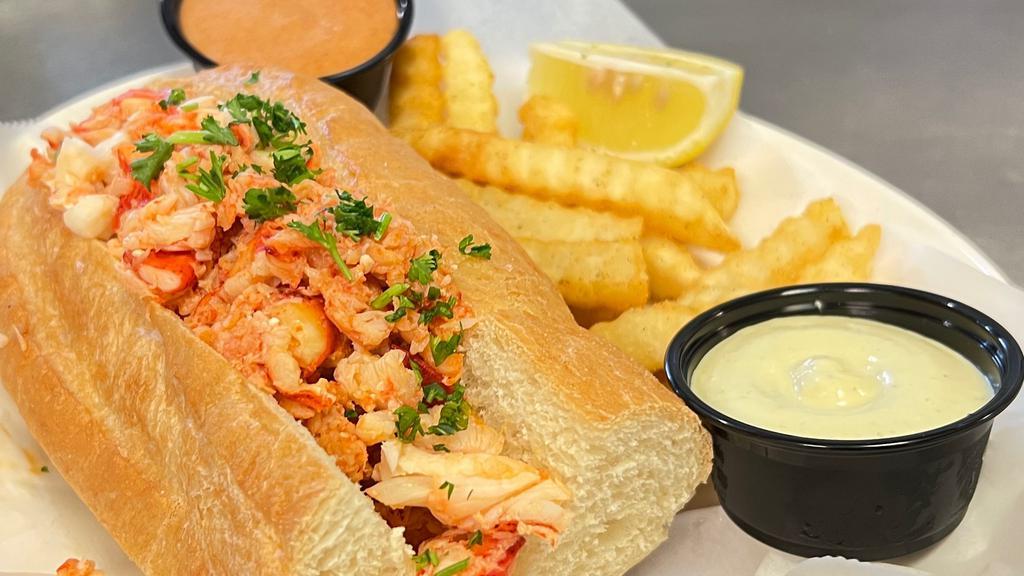 Lobster Roll · Made with lobster tail and claw meat, served with fries Choice of fresh lemon garlic butter or cilantro aioli sauce.