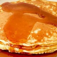 Pancakes · Choice of short or tall stack of fluffy pancakes with syrup.