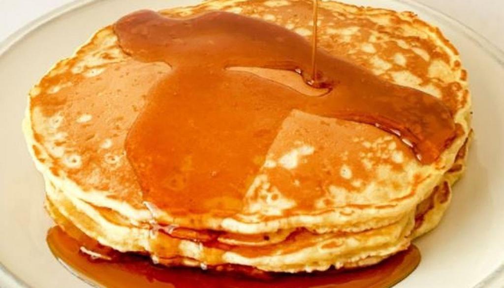 Pancakes · Choice of short or tall stack of fluffy pancakes with syrup.