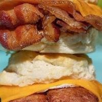 Breakfast On A Biscuit · fried egg, cheddar cheese & andouille sausage, bacon or boudin on homemade biscuit