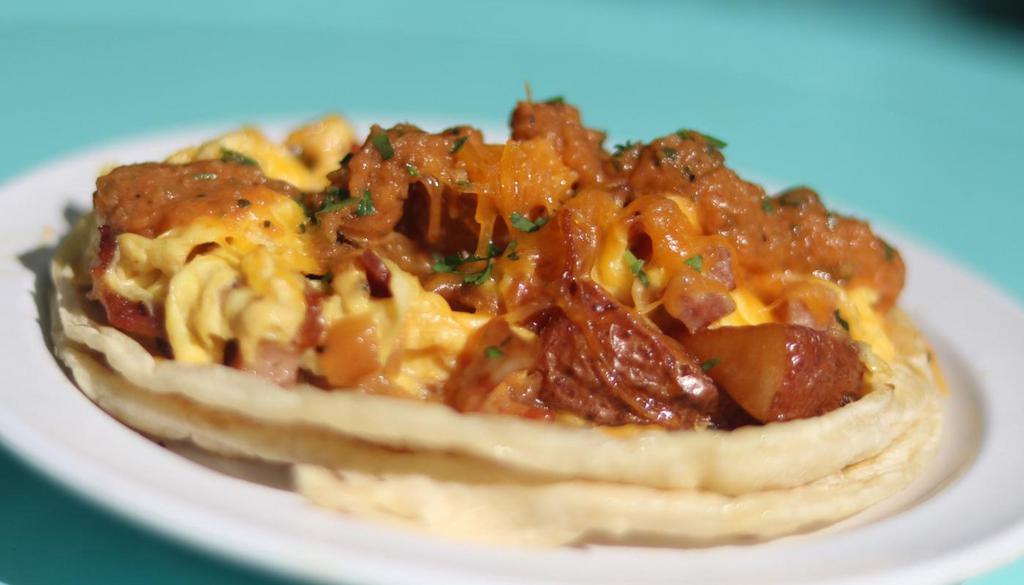 Arkie'S Taco · egg, potato, cheddar, sausage, bacon & grilled onions. Served w/ homemade roasted salsa. Choice of corn or flour tortilla.