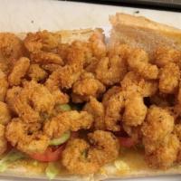 Fried Shrimp Po-Boy · Served on Leidenheimer bread & dressed (Lettuce, tomato, pickles, and remoulade) with Fries ...