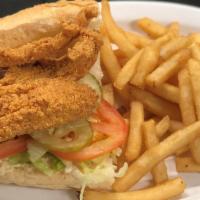 Fried Catfish Po-Boy · Served on Leidenheimer bread & dressed (Lettuce, tomato, pickles, and remoulade) with Fries ...