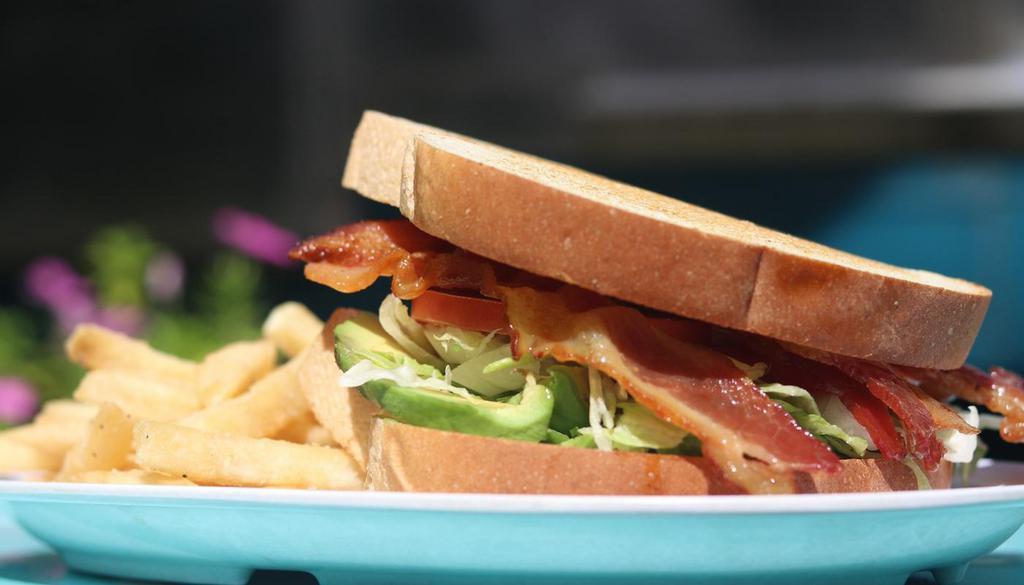 L.A.T · Bacon, lettuce, avocado & tomato on Texas toast. Served w/ fries.