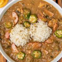 Gumbo · Traditional dark-roux andouille sausage and chicken gumbo.  Choice of size, comes with cornb...