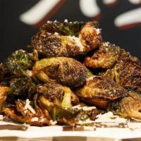 Fried Brussels Sprouts- · fresh Brussels flash fried and topped with parmesan and  balsamic glaze