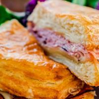 Ham & Swiss Croissant · Black Forest Ham, Swiss Cheese, and a house Honey Mustard Reduction toasted on a signature s...
