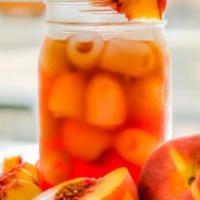 Peach Iced Tea · Cool down with this crisp, refreshing black tea layered with all-natural peach essence.