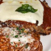 Breadless Chicken Parmesan · Parmesan crusted, mozzarella, and fresh basil, served with spaghetti.
