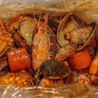 Seafood Boil Pot · cajun-style boil, manila clams, shrimp, corn, hot links with spicy lemon pepper garlic sauce.