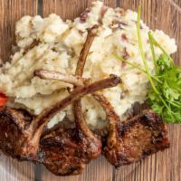Roadside Lamb Chops · Lamb chops  with loaded potatoes (includes pork-bacon bits, green chives & cheese on top pot...