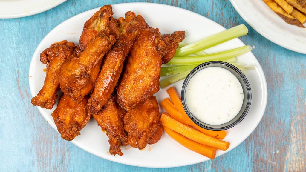 Wings · Buffalo Wimpy/Medium/Caliente, Honey Sriracha, Zombie Boogie BBQ, Garlic Parmesan, Apple BBQ, and Memphis BBQ. Served with veggies and your choice of bleu cheese or ranch dressing.