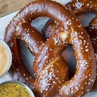 Baked Soft Pretzel · Two hearth-baked salted pretzels, Oliver Brewing Co. beer cheese sauce, and tangy beer musta...
