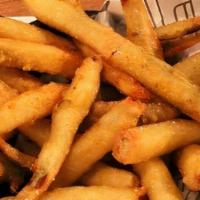 Pickle Fries · Gluten friendly dish. Coated in masa, fried crispy and dusted with old bay. Served with garl...