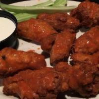 Buffalo Wings · Our great wings baked in our own spicy buffalo sauce. Served with celery sticks and bleu che...