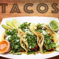 Bisteck Tacos/ Steak Tacos · Tres Tacos Por Orden/Three Tacos Per Order 

All tacos come with onions, cilantro, sour crea...