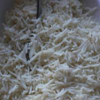 Jeera Rice · Long grained aromatic basmati rice with peas and carrots and tempered with cumin for jeera r...