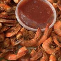 Spiced Shrimp Platter · Approximately hundred large shrimp, cocktail sauce and garnish.