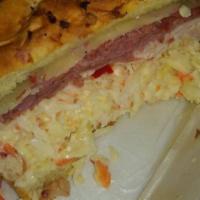 Dinty Moore · Corned beef, turkey, coleslaw, and swiss cheese.