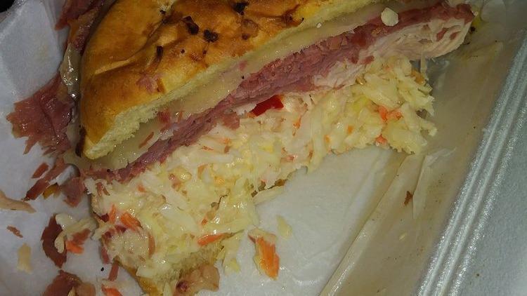Dinty Moore · Corned beef, turkey, coleslaw, and swiss cheese.