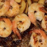 Surf & Turf Combo · 10 oz New York strip and jumbo shrimp (8 pcs). Served with breadsticks and your choice of so...