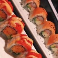 Shelbyville Roll · Crab, cream cheese, avocado, topped with layer smoke salmon scallion, and black sesame seed.