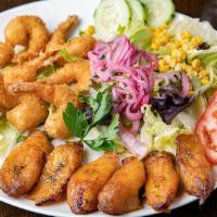 Camarones Empanizados · Breaded shrimp.