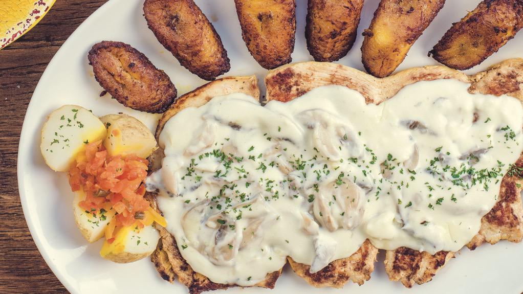 Pechuga A La Colombiana · Grilled chicken with mushrooms in cream sauce.