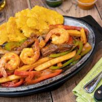 Mar Y Tierra Salteado · Sautéed flank steak and shrimp with peppers and onions.