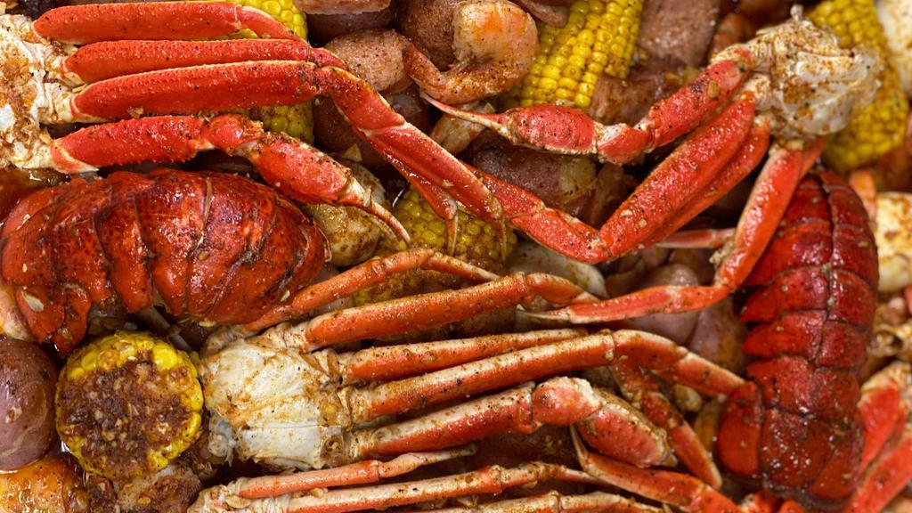 Combo C · 5 Eggs, 5 Corns, 10 Potatoes, 2 Lobster tails, 2 lbs of Snow Crab (4 clusters), 2 lbs of Shrimp no head, 1 lb of Sausage