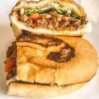 Pollo Torta · Marinated chicken. Mexican sandwich that includes refried beans, onions, guacamole, lettuce,...