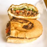 Chorizo Torta · Pork sausage. Mexican sandwich that includes refried beans, onions, guacamole, lettuce, toma...