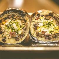 Pescado Burrito · Grilled tilapia. Includes rice, pinto or black beans, lettuce, sour cream, cheese, corn, oni...