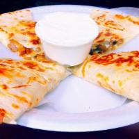 Pollo Quesadilla · Marinated chicken. Fresh, melted white cheese wrapped in a flour tortilla. With a side of so...