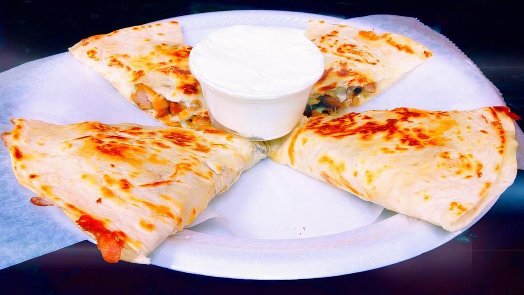 Al Pastor Quesadilla · Marinated pork. Fresh, melted white cheese wrapped in a flour tortilla. With a side of sour cream.