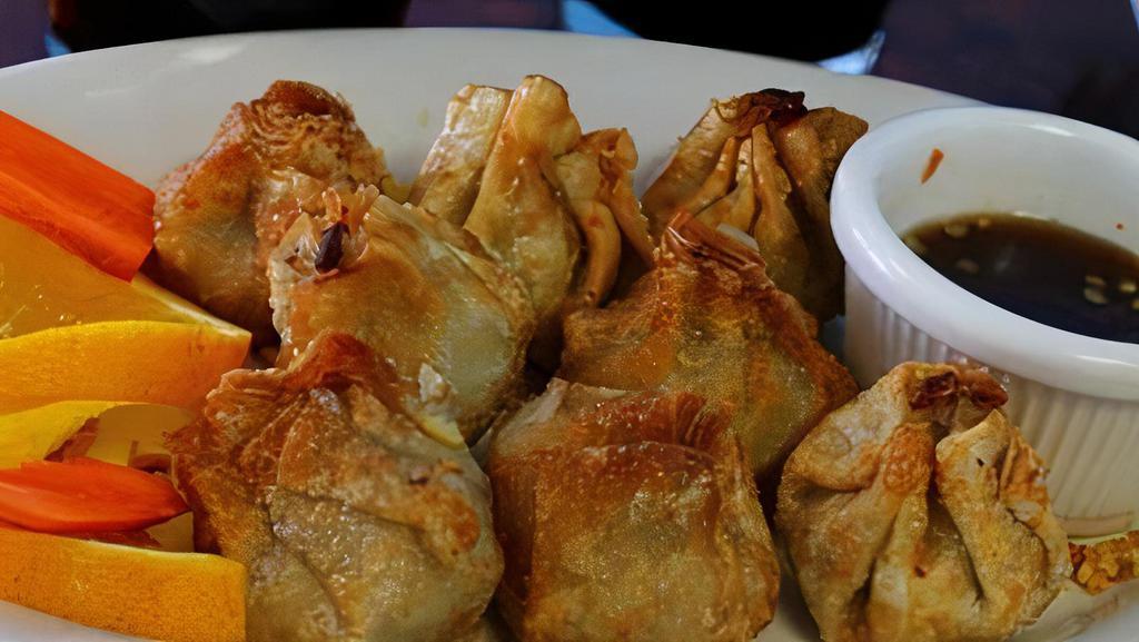 Dumplings (Steamed Or Fried) (6) · Minced pork with yellow onion, water chestnut, and garlic, wrapped in wonton skin, served with house dumpling sauce (add half steamed/half fried for an additional cost).