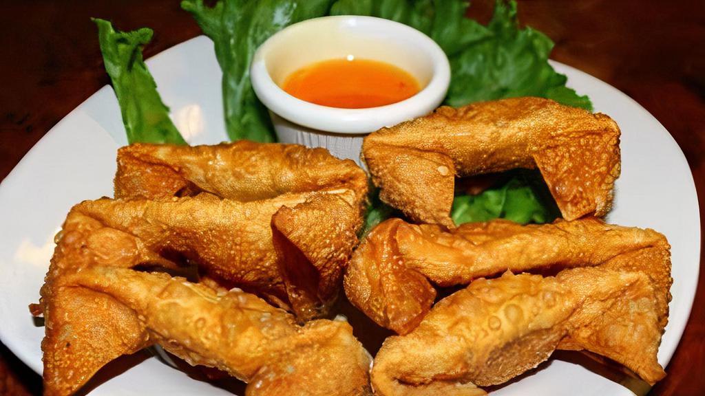 Crab Rangoon (6) · Wontons filled with cream cheese, imitation crab, green and yellow onions, served with house sweet & sour sauce.
