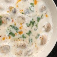 Tom Kha Gai (Gf) · Creamy coconut milk soup with chicken, yellow, and green onions, galangal, mushrooms, lemong...